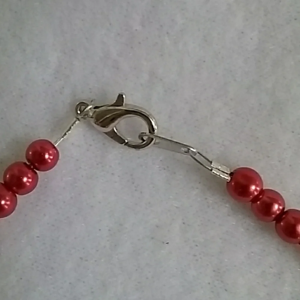 Girls beaded necklace with flower charm